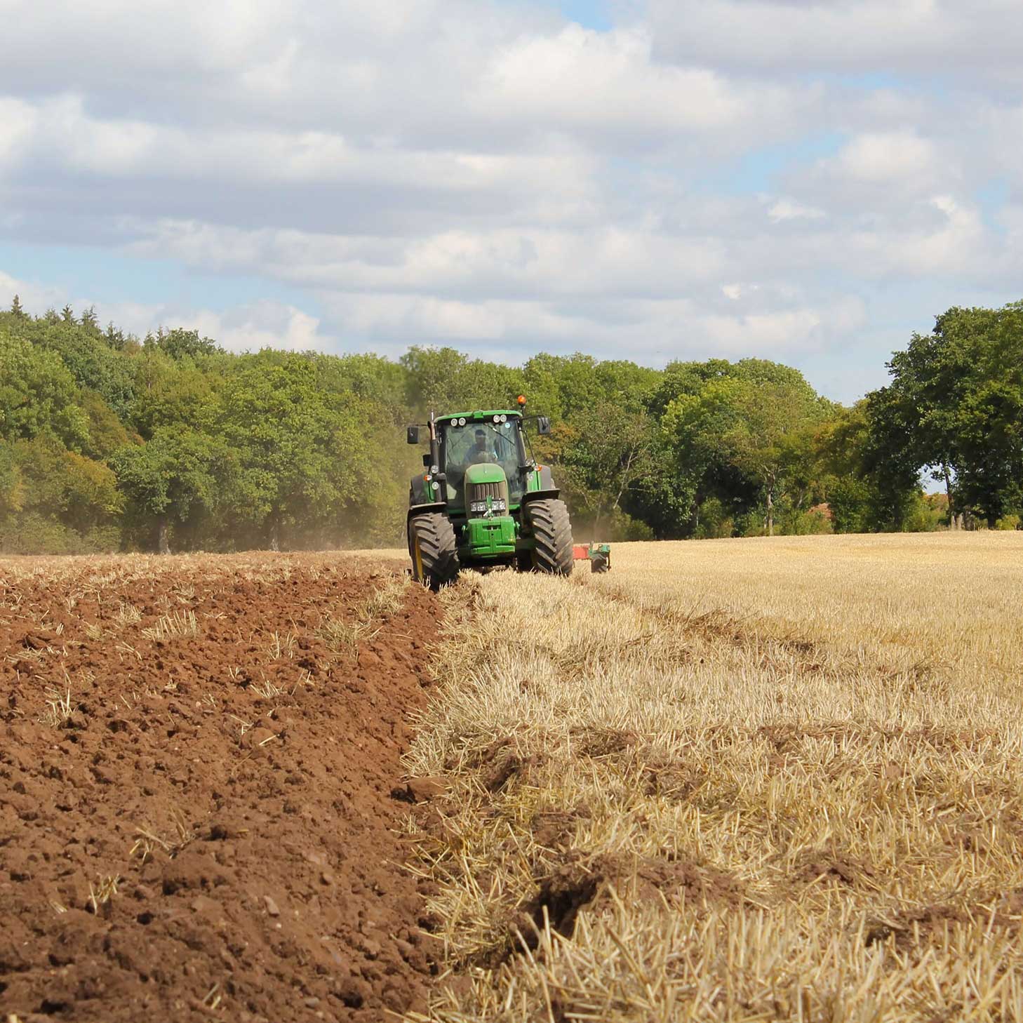 Image of a tractor ploughing a field